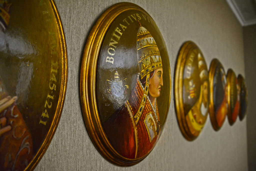 Antique Popes portraits collection at Villa Principi Della Spina popes room